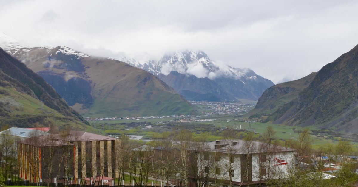 View from Rooms Hotel over a large valley and over to Kazbek Mountain range.