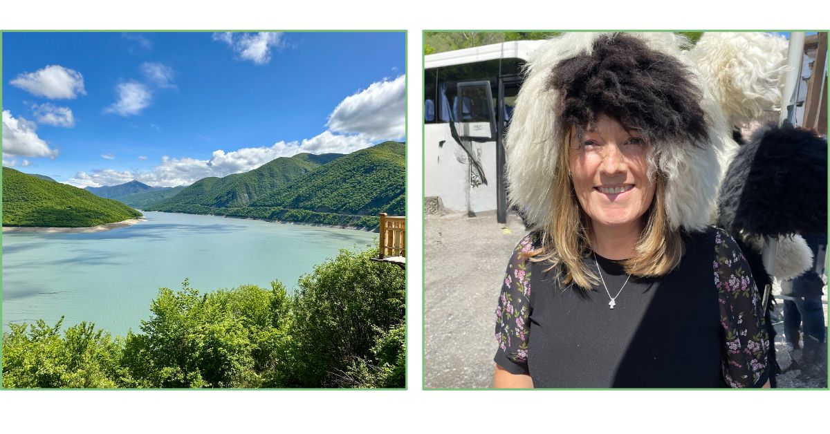 A view of blue water of a reservoir in Georgia and a woman trying on an original Georgian sheep wool hat.