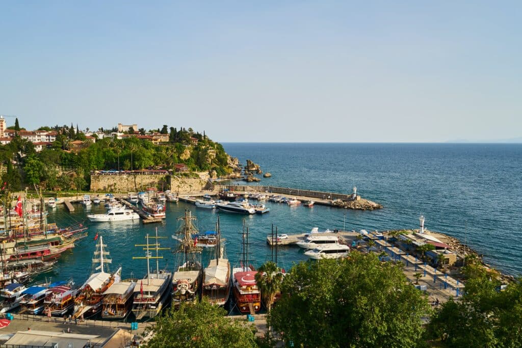 A traditional fishing harbour in Antalya, Southern Turkey. A stone wall protects the boats and acts as a retainer wall.