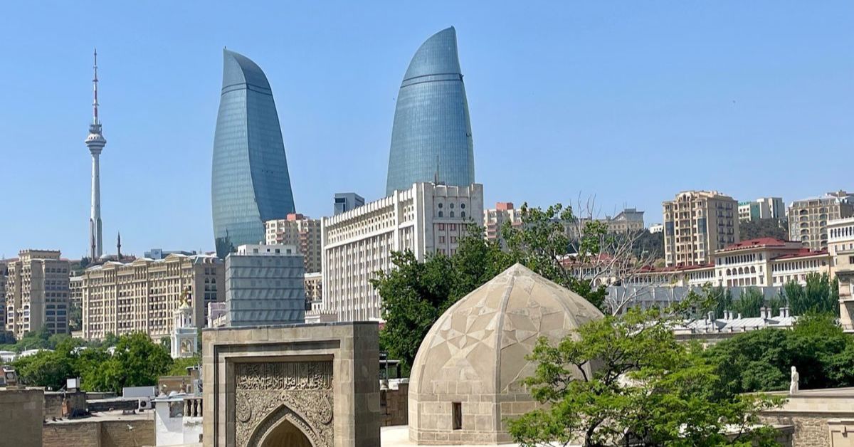 Old City Baku with its many medieval buildings, soviet era architecture and 21st century glass front flame tower buildings.