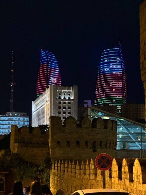 City Night View of Baku with old city wall and Flame Towers lit up