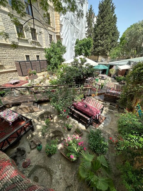Teahouse in Baku in a garden full of colorful plants