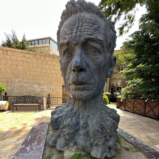 A famous statue in Baku Azerbaijan depicts the neck and face of a revered  poet with incredible detail.