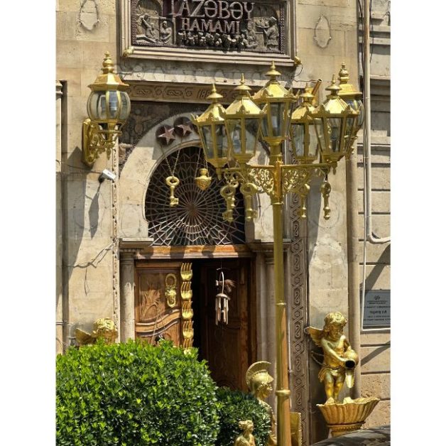 Gold lighting and ornaments at doorway of a Hamam in Baku.