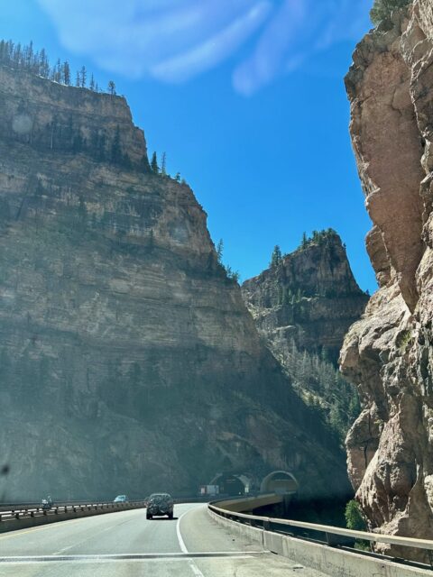 Driving through Glenwood Canyon with sheer rock on both sides
