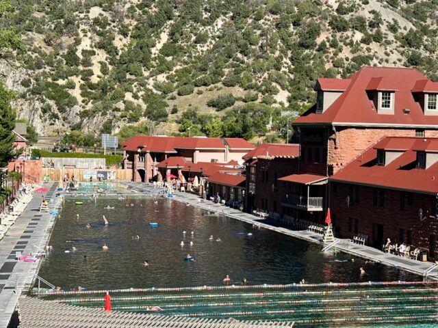 Glenwood Hot Springs on Denver roadtrip shows a large pool and the red tiled roof of the resort.