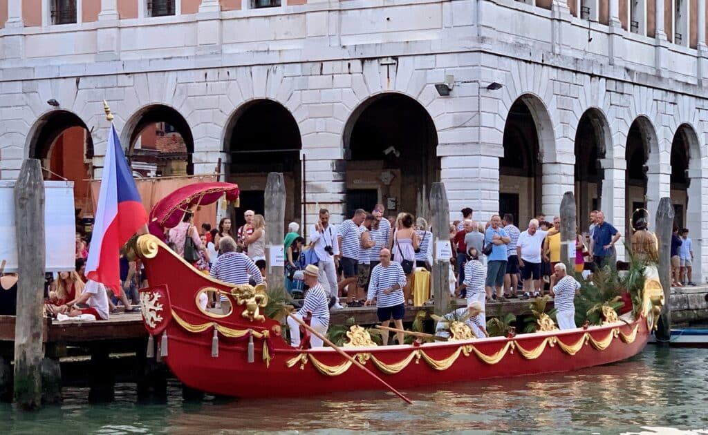 A decorated boat in a Venice canal for the annual Regata Storica di Venezia which is a huge boat race on the canals.