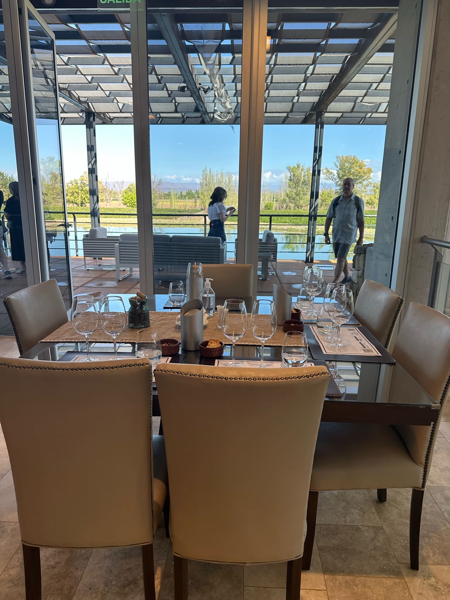 Winery restaurant with views out to vineyard and set for lunch.