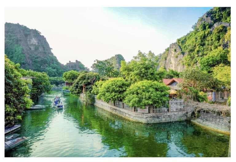 A view of rural Vietnam with mountains and waterways. This illustrates a post on how to plan for 11 days in Vietnam.