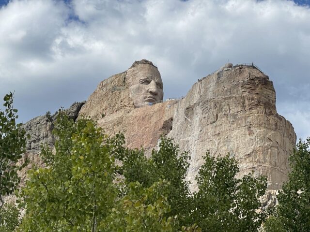 Crazyhorse is carved out of mountain rock and depicts a historical figure from the region.