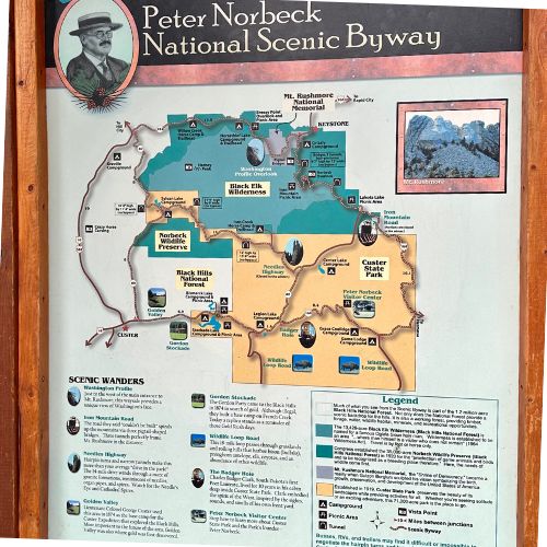Information board and map of Peter Norbeck Highway, one of the top unique things to do in Black Hills South Dakota.