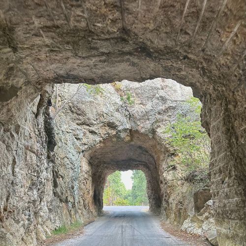 Stone archways on a small single track road in black hills south dakota
