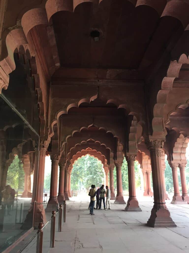 Multiple red brick archways that are part of the Red Fort in Delhi India.