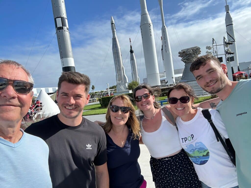 Family at Kennedy Space Center Florida with rockets in background