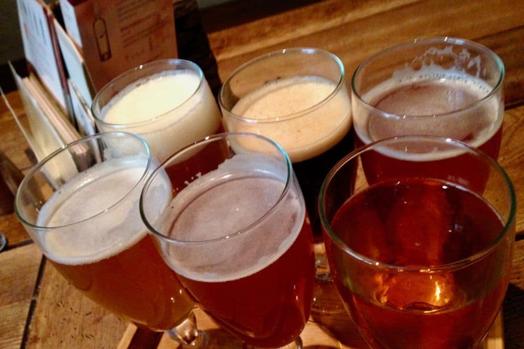 Tray of beers in a traditional brewery in Vilnius Lithuania served as part of a tasting.