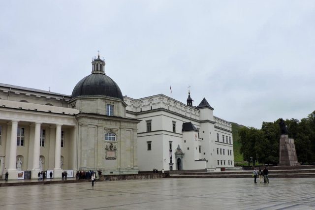 Cathedral with a dome and stone columns. The building in Vilnius is white in colour.