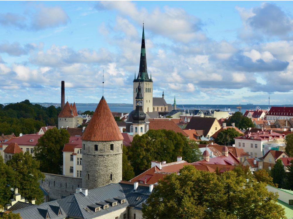 Spires and rooftops of red tile in Tallinn Estonia.
