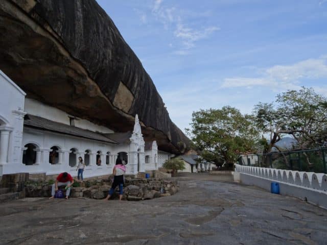 Entrance to Pidurangala Rock with whitewashed building where you buy tickets to enter.