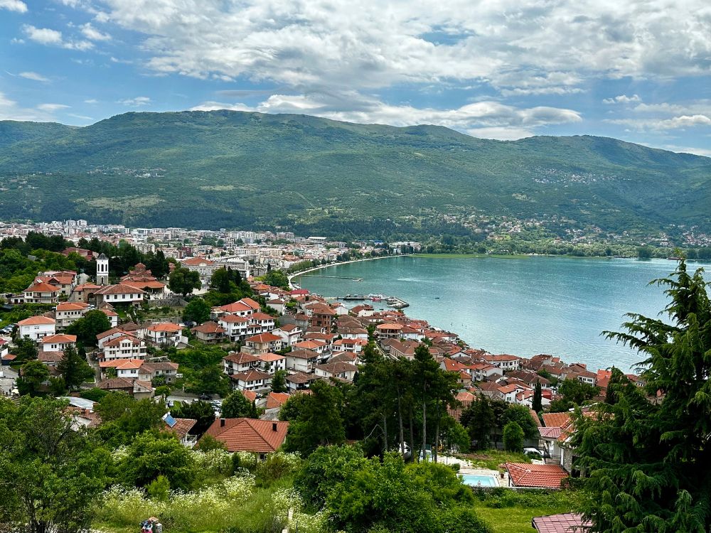 North Macedonia town of Ohrid with its UNESCO red roofed old town and Lake Ohrid in the background.