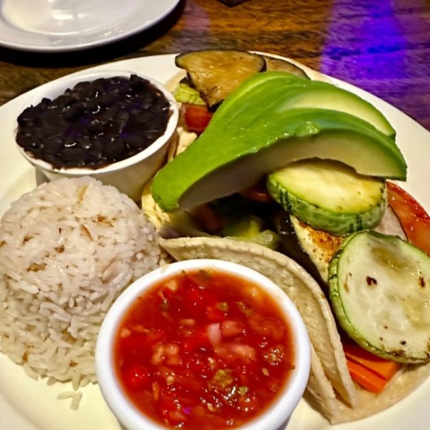 Dinner plate showcasing Costa Rica fresh vegetables, rice and beans.