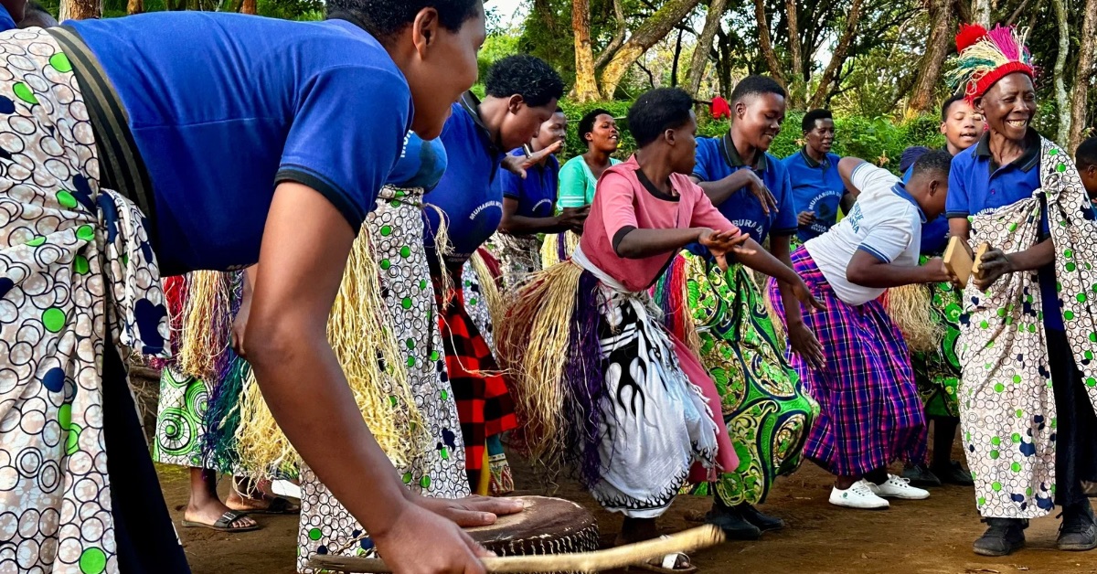 Local residents perform traditional songs and dancing at Mgahinga National Park base camp.