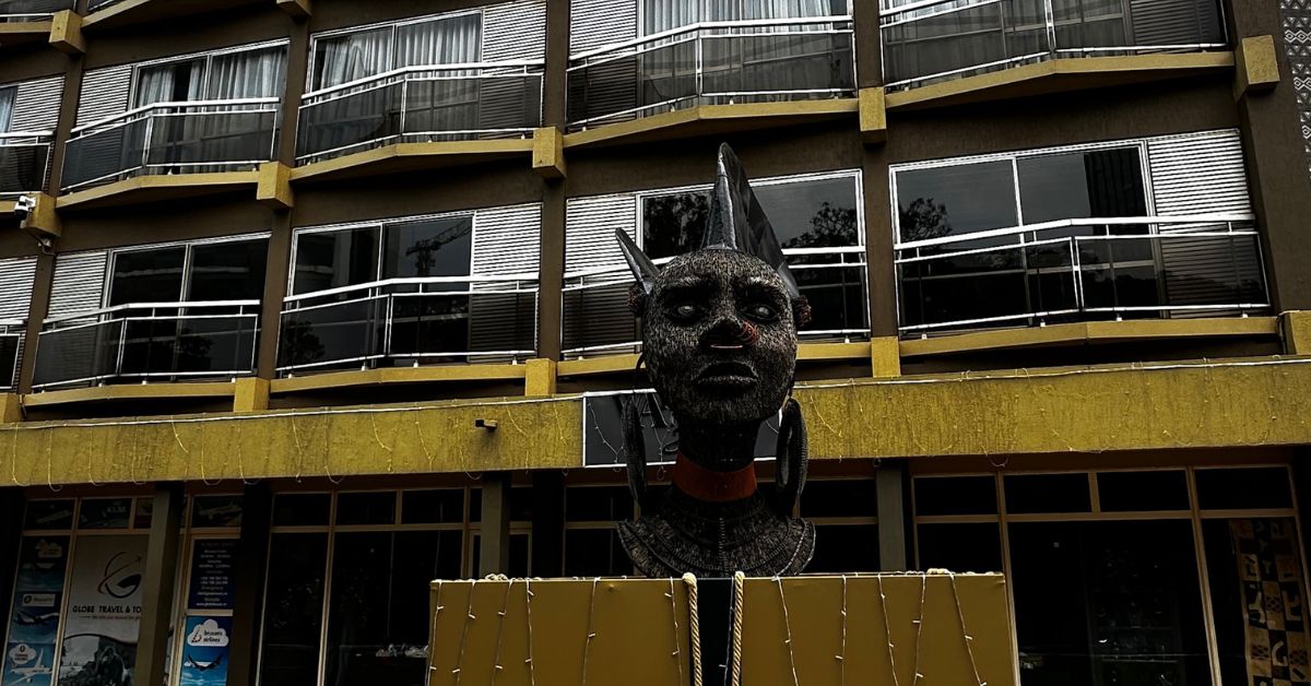 A statue of a woman in traditional dress outside the Hotel des Mille Collines.