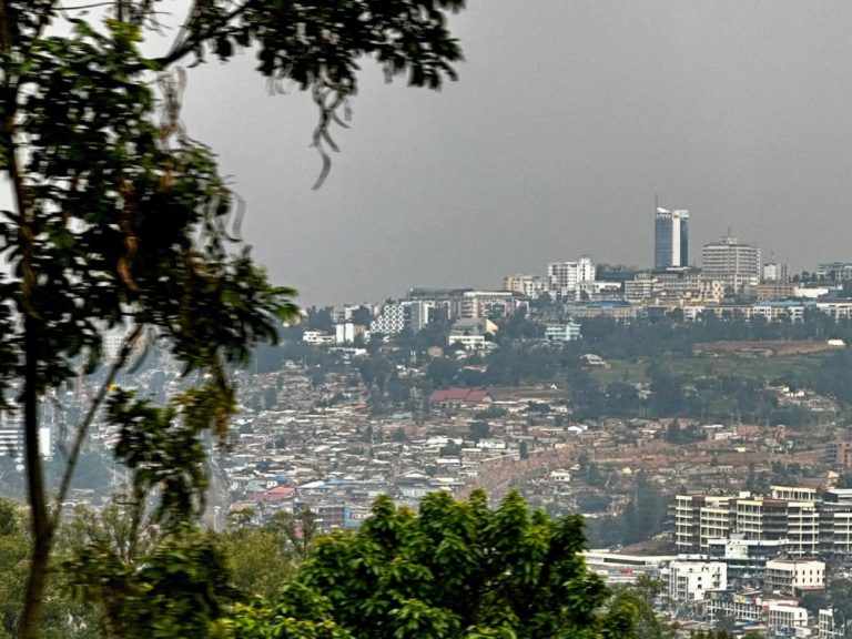 View of Kigali Rwanda shows expanse of city over hills and valleys.