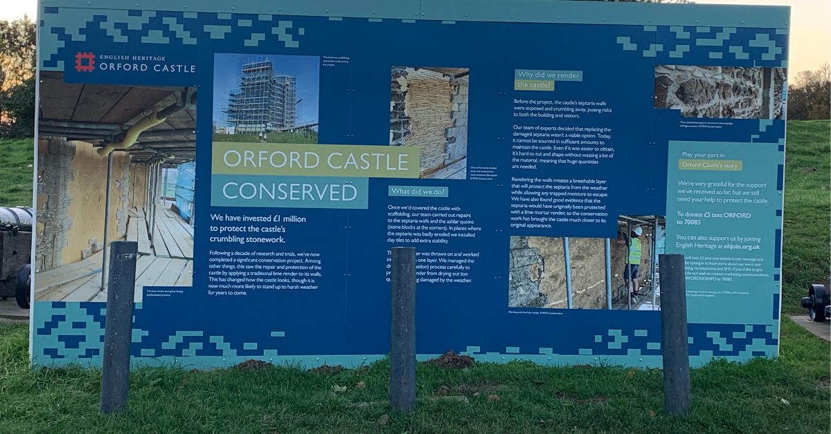 A large sign outside Orford castle explaining how the castle is conserved.