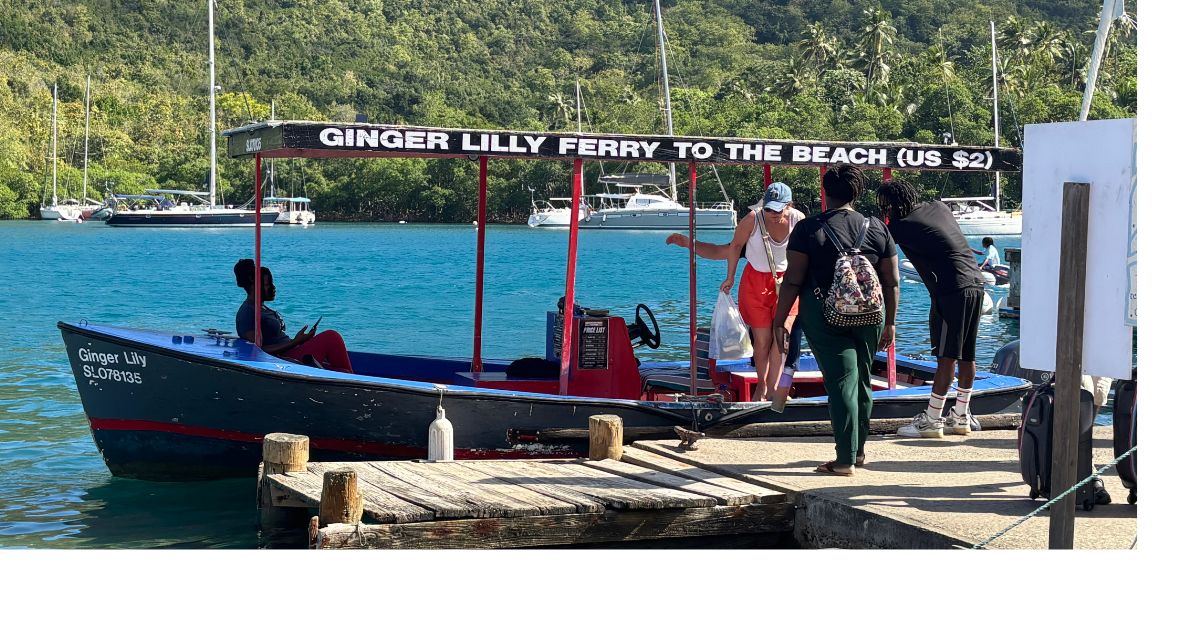 Small ferry boat with open sides called Ginger Lily. woman getting off the boat onto a boardwalk.