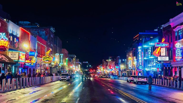 Neon lights frame street in Nashville.